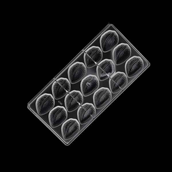 A clear plastic chocolate mold shaped like leaves, featuring a total of 15 individual leaf-shaped cavities. Each cavity has detailed vein patterns, creating a realistic leaf texture. The mold is shown from a top-down perspective against a black background.