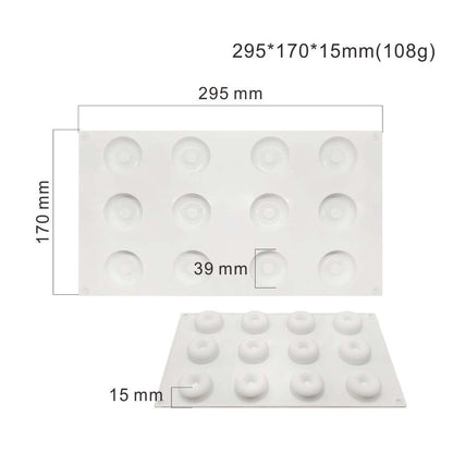A white silicone mould for baking mini donuts, featuring 12 cavities arranged in two rows. The dimensions are labeled as 295 mm by 170 mm by 15 mm, with each cavity having a diameter of 39 mm. The mould is flat and has a smooth surface, suitable for easy release of baked goods.