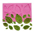 A pink silicone mould featuring several leaf shapes, including large and small rose leaves, is displayed at the top. Below the mould are various green leaf-shaped decorations that appear to have been made using the mould, showcasing different sizes and orientations of rose leaves.