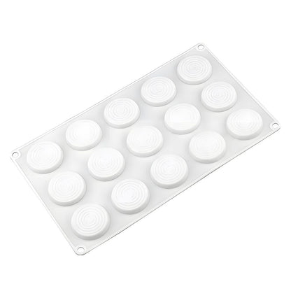Silicone mold with 15 round cavities, each featuring spiral patterns. The flexible, white tray includes holes at corners, designed for easy hanging.