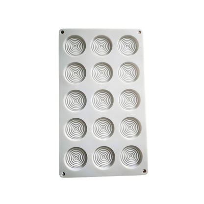 White silicone baking mold with 15 circular spiral cavities, arranged in a 3x5 grid. The design is simple and modern, evoking a playful tone.