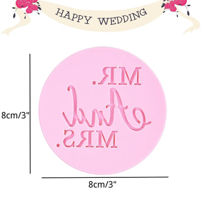 An 8 cm round pink cookie stamp is displayed, featuring the embossed text "MR. &amp; MRS." in a decorative font. The stamp also has measurement labels indicating its diameter and height. At the top of the image, there is a banner that reads "HAPPY WEDDING," adorned with small floral designs.