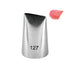 A metal piping nozzle labeled "127" with a tapered design, positioned next to a small dollop of pink icing. The nozzle has a slightly open tip to allow for decorating with frosting.