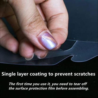 An image showing a hand with a nail polish design peeling off a protective film from a transparent round PVC cake box. Text overlays state, "Single layer coating to prevent scratches" and "The first time you use it, you need to tear off the surface protection film before assembling."