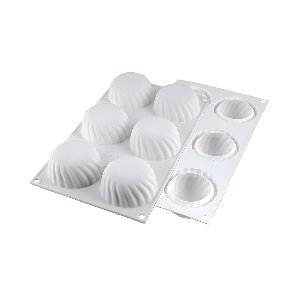 Four assorted cupcakes displayed on a white plastic tray, featuring vibrant frosting and decorative toppings.