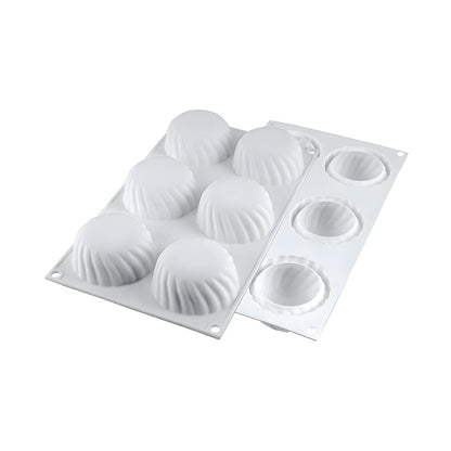 Four assorted cupcakes displayed on a white plastic tray, featuring vibrant frosting and decorative toppings.