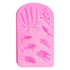 The image shows a pink silicone mould featuring various underwater-themed designs. The mould includes several fish shapes and marine elements such as seaweed and coral. The designs are raised, allowing for detailed impressions. The overall shape of the mould is rectangular with rounded edges.