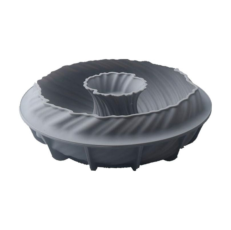 A gray silicone bundt cake mold with intricate, swirling ridges and a central tube. The mold has a soft, flexible texture and a modern design.