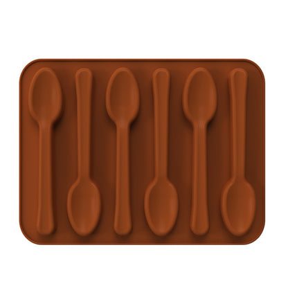 A brown silicone mold shaped like six spoons, all arranged in a rectangular format. The spoons have a rounded bowl and elongated handle, designed for creating spoon-shaped treats or chocolates.