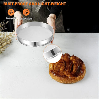 Person holding a shiny, round silver tray above a loaf of bread on a white surface. Text indicates it is rust-proof and lightweight. Cozy kitchen vibe.