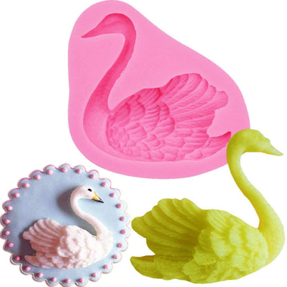 The image features a pink silicone mold shaped like a swan, designed for baking or crafting. To the right of the mold, there&