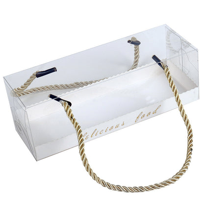 A clear, rectangular plastic box designed to hold baked goods, specifically for Swiss rolls. The box features a decorative golden handle made of twisted rope and has the text "delicious food" printed on one side. The design allows visibility of the contents inside, with rounded edges and a clean, elegant appearance.