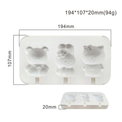 A white silicone mould designed for making teddy bear and character-shaped cakesickles. The mould features three cavities: a teddy bear on the left, a character with a bow in the center, and a cat-like character on the right. Dimensions of the mould are indicated as 194mm x 107mm x 20mm.