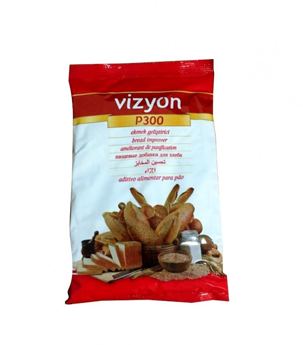 The image features a red and white 500g packaging of the product "vizyon P300 bread improver." The front of the packet displays the brand name "vizyon" prominently at the top, followed by the product designation "P300." Below this, there are various descriptions in multiple languages including "bread improver," "améliorant de panification," and others. The background design includes an arrangement of different types of bread, flour, and baking utensils, emphasizing the product&