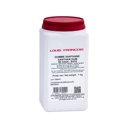 A small container of white powder isolated on a black backdrop.